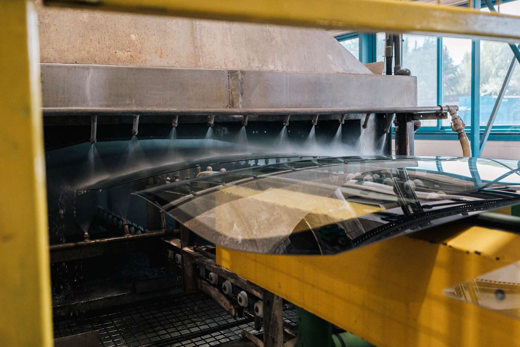 Windscreen being processed by a machine