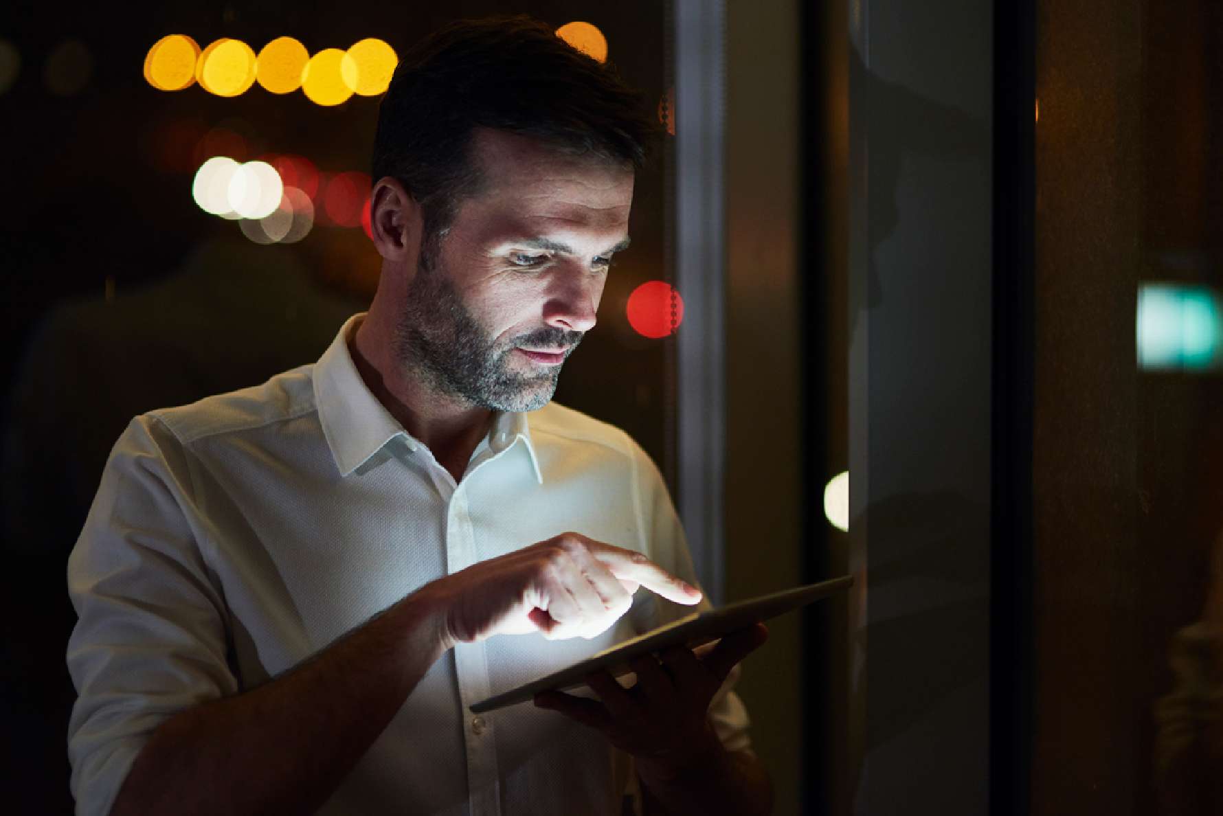 man holding tablet device