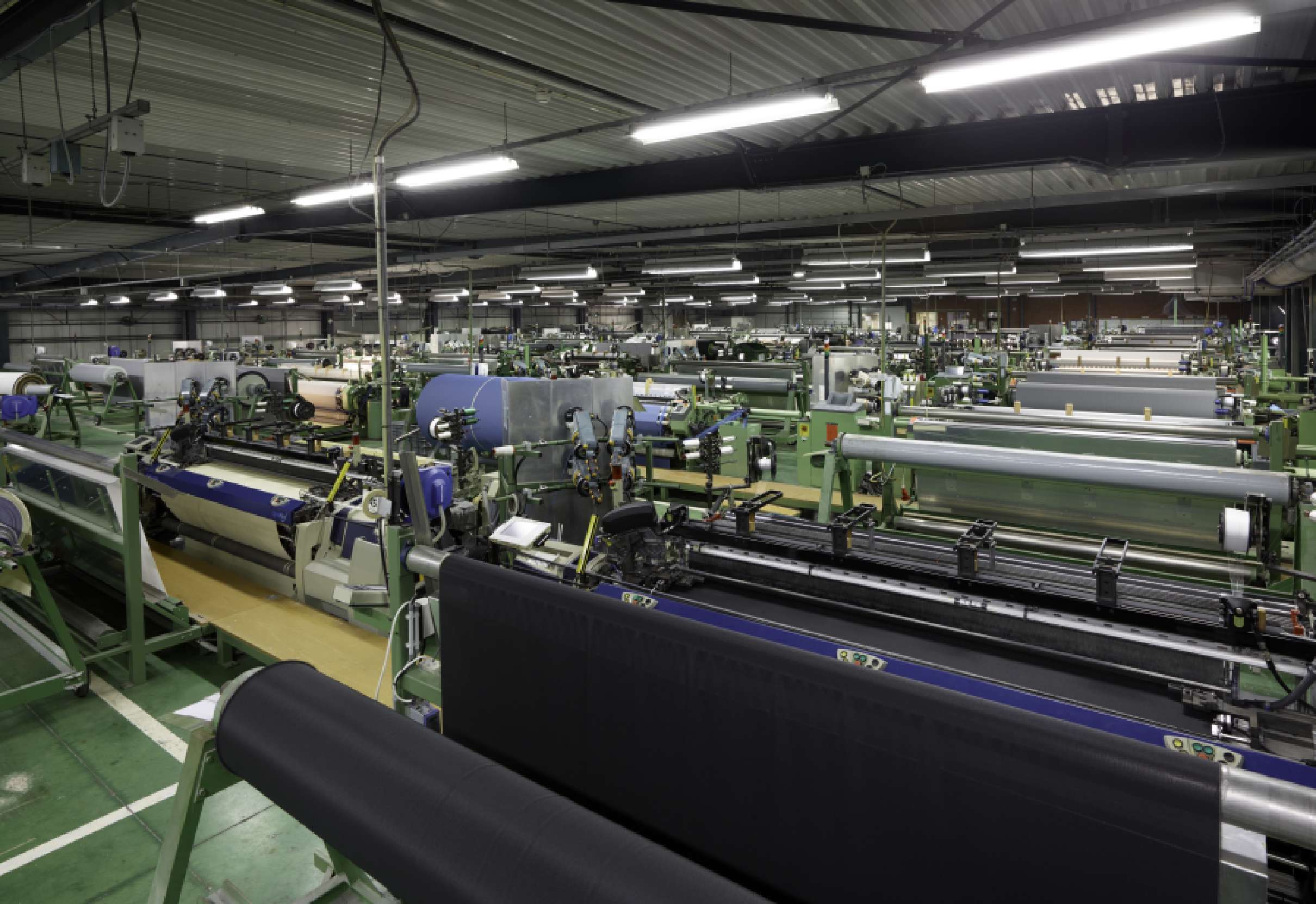 Looms in the production facility